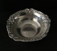 Silver chase & repoussé  bowl.  Weighs 52gms & is 5inch diameter.  Estimate £30-40.