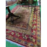 Red ground wool carpet, 280cms x 190cms. Estimate £50-80.