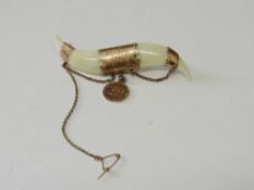 Gold coloured metal mounted bone brooch with small medal engraved Victoria B.C. On reversed date