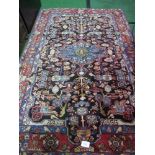 Red Persian-style carpet, 1.5m x 2.3m