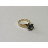 9ct gold ring with a prominently set circular pale green stone, diameter approx 9mm, size O, total