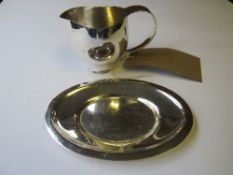 Silver hallmarked small jug, London 1980 by Graham Watling, 6.275ozt & a small silver plated dish.