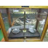 A set of Griffin & Tatlock precision scales in glass & wood case c/w 2 sets of weights. Estimate £