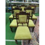 6 carved oak dining chairs with upholstered seats & back panel. Estimate £30-50.