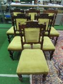 6 carved oak dining chairs with upholstered seats & back panel. Estimate £30-50.