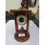 Quartz mahogany Portico clock. Estimate £30-50.
