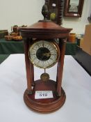Quartz mahogany Portico clock. Estimate £30-50.