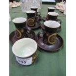 A set of 6 Denby arabesque coffee cups & saucers (chips to one) & a matching sugar bowl. Estimate £