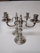 A pair of silver single/two branch candelabrum by J A Campbell, London 1978/79. Estimate £100-150.