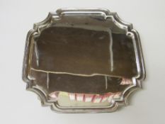 A silver tray with indented corners & 4 scroll feet by Mappin & Webb, Sheffield, 1940, 31ozt.