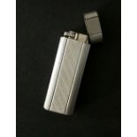Vintage Cartier silver plated lighter.  In working order, without flint.  Estimate £40-50.