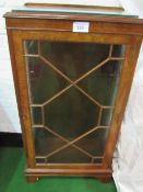 A glass fronted walnut display cabinet on pedestal base (with key) 59cms x 116cms x 35cms.