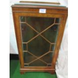 A glass fronted walnut display cabinet on pedestal base (with key) 59cms x 116cms x 35cms.