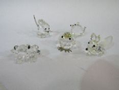 Small collection of Swarovski crystal animals: fox, mouse, frog, bird & pig. Estimate £10-20.