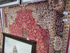 Red ground Keshan carpet, 280cms x 200cms. Estimate £70-90.