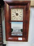 Mahogany cased American wall clock by Seth Thomas with key, weight & pendulum. Estimate £20-30.