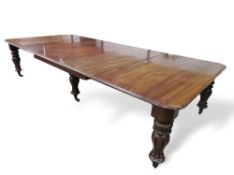 Victorian mahogany extending dining table on 6 decorative turned & reeded legs to castors, c/w 3