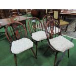 4 Ercol dining chairs. Estimate £40-60.