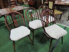 4 Ercol dining chairs. Estimate £40-60.