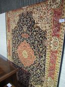 Blue ground Keshan carpet, 230cms x 160cms. Estimate £60-80.