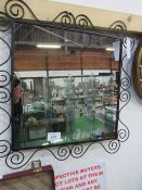 Wrought iron framed wall mirror. Estimate £12-18.