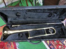 A trombone (no mouth piece) in hard case. Estimate £10-20.