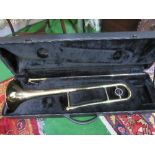 A trombone (no mouth piece) in hard case. Estimate £10-20.