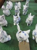 A set of 12 porcelain animal jugs, Country Friends by Hallie Greer c/w display shelves. Estimate £