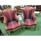 Pair of circa 1840 French Louis XVI giltwood throne wing chairs, covered in burgundy damask silk.