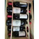 A case of 12x 75cl bottles of Chateau Canon, 1983. Estimate £40-60.