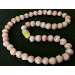 18inch Angle skin coral choker necklace.  Each bead is in excellent condition measuring 9mm & the