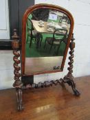 Mahogany framed toilet mirror with spiral twist supports, 77cms height