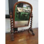 Mahogany framed toilet mirror with spiral twist supports, 77cms height