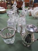 6 various cut glass decanters, glass ice bucket c/w tongs & silver plated lidded jug. Estimate £20-