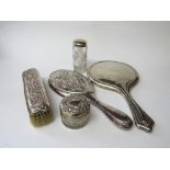 Hallmarked silver backed dressing table mirror, another with matching clothes' brush, silver handled