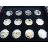Case of 12x 25 dollars Solomon Islands coins, gold plated on silver depicting types of aircraft.