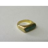 18ct gold ring set with large oblong green stone approx 18mm x 6mm, size R 1/2, total wt 8.0gms.