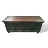 Oak blanket box with carved front standing on bun feet, 107cms x 44cms x 39cms. Estimate £30-50.