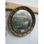 Circular gilt famed wall mirror. Estimate £5-10.