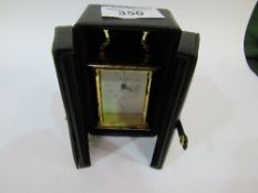 Churchill quartz carriage clock with white dial with Roman numerals, boxed. Estimate £15-20.