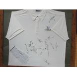 A framed & glazed golfing glove & shirt, shirt signed by various players including Colin Montgomery,