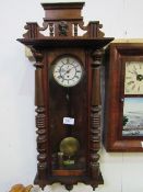 Mahogany Vienna wall clock with enamel dial, 115cms x 42cms. Estimate £40-60.