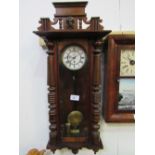 Mahogany Vienna wall clock with enamel dial, 115cms x 42cms. Estimate £40-60.