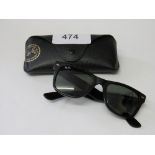 Original Ray Ban sunglasses in leather case. Estimate £30-40.