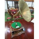 Rare early HMV wind-up large brass horn mounted record player. Estimate £30-50.