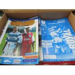 4 boxes of Reading Football Club home game programmes from 1958 to 2001. Estimate £50-80.