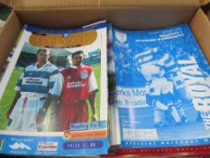 4 boxes of Reading Football Club home game programmes from 1958 to 2001. Estimate £50-80.
