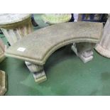 Concrete curved garden seat with 2 carved supports, 107cms x 36cms x 43cms. Estimate £20-30.