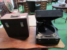 Decca wind-up gramophone c/w handle, plus a case containing some 78rpm records. Estimate £50-80.