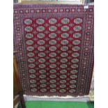Red ground Bokhara carpet, 2.3 x 1.6. Estimate £90-110.